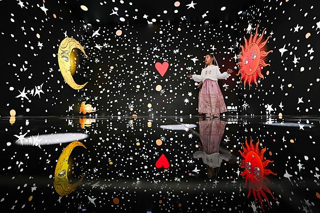 A child immerses herself in a digital art exhibition during the 2024 China International Fair for Trade in Services (CIFTIS) in the Cultural &amp; Tourism Service thematic exhibition area at the Shougang Park in Beijing, capital of China, Sept. 15, 2024. (Xinhua/Ju Huanzong)