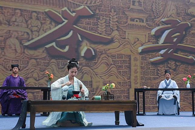 Jingshan Tea Ceremony is performed during an activity marking the Cultural and Natural Heritage Day in Hangzhou, east China's Zhejiang Province, June 9, 2023. (Xinhua/Xu Yu)