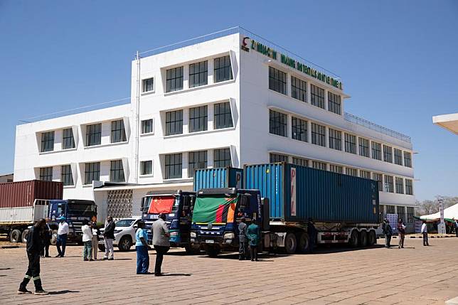 Containers of equipment and machinery transported from China are seen in front of the office building of Mulungushi Textiles in Kabwe, Zambia, Aug. 26, 2024. (Xinhua/Peng Lijun)