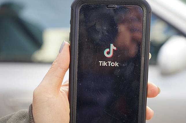 Photo taken on Oct. 12, 2023 shows a cell phone screen with TikTok App outside the U.S. District Court for the District of Montana in Missoula, Montana, the United States. (Photo by Zeng Hui/Xinhua)