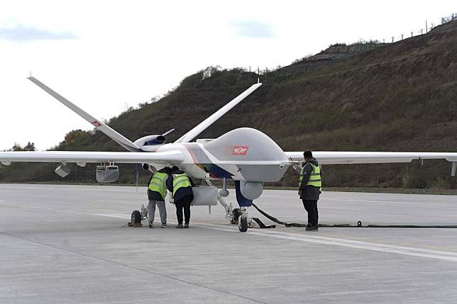 A Wing Loong-2 large unmanned aerial vehicle (UAV) is examined before taking off from an airport in the city of Zigong, southwest China's Sichuan Province, March 18, 2024. (Aviation Industry Corporation of China/Handout via Xinhua)