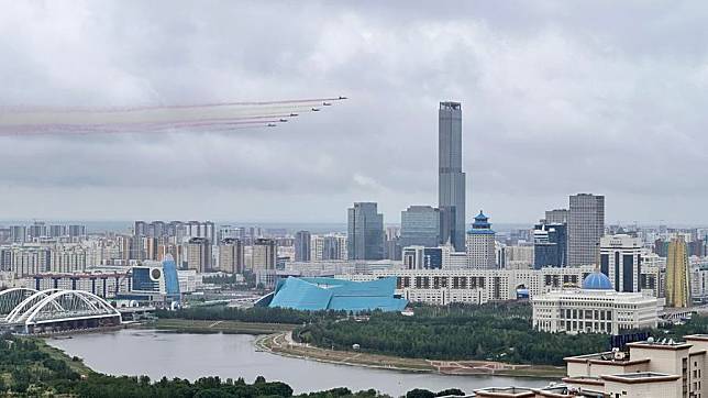 Kazakh fighter jets paint the sky with colored smoke trails as Kazakh President Kassym-Jomart Tokayev hosts a welcome ceremony for visiting Chinese President Xi Jinping, in Astana, Kazakhstan, July 3, 2024. (Xinhua/Lu Jinbo)