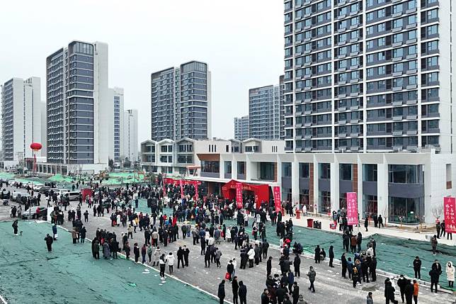 An aerial drone photo taken on Jan. 16, 2024 shows people waiting to receive the keys to their new homes at a relocation residential complex in Shijiazhuang, north China's Hebei Province. (Xinhua/Yang Shiyao)