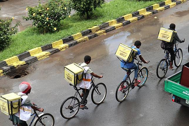 Backpack bikers of Pick Delivery ride on the street in Adama, the capital of Ethiopia's Oromia regional state, on Oct. 11, 2024. (Xinhua/Misikir Temesgen)