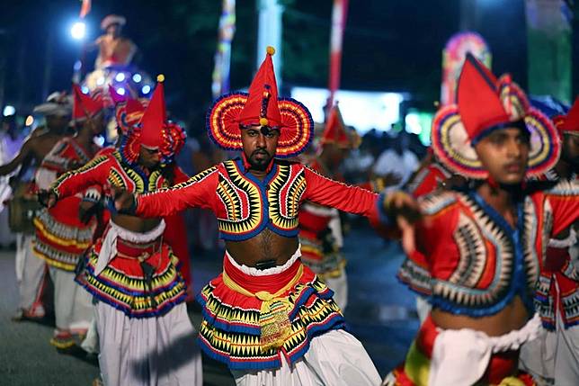 Dancers perform during the Duruthu Perahera festival at a temple in Kelaniya, Sri Lanka, Jan. 12, 2025. (Photo by Ajith Perera/Xinhua)