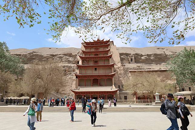 Tourists visit the Mogao Grottoes in Dunhuang, northwest China's Gansu Province, May 11, 2023. (Xinhua/Ma Xiping)