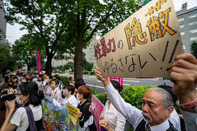 People gather in front of the country's Ministry of Foreign Affairs to protest against the Japanese government for concealing the alleged sexual assault cases involving U.S. military personnel in Japan from the public in Tokyo, Japan, July 2, 2024. (Xinhua/Zhang Xiaoyu)