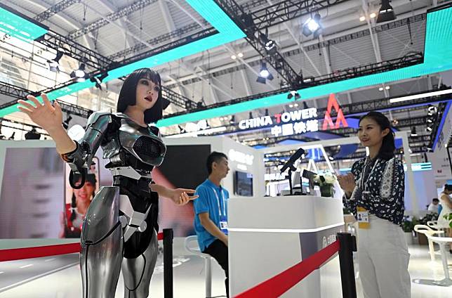 A visitor interacts with a bio-robot at the World Intelligence Expo 2024 in north China's Tianjin, June 20, 2024. (Xinhua/Zhao Zishuo)