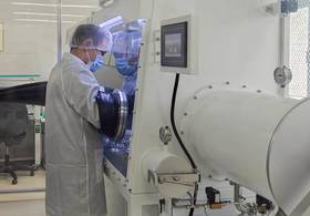A researcher with the Institute of Geology, Chinese Academy of Geological Sciences, prepares the lunar samples collected by the Chang'e-6 mission at the institute in Beijing, capital of China, on Feb. 26, 2025. (Xinhua/Yu Fei)