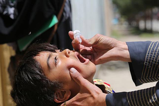 A child receives a dose of polio vaccine in Kabul, the capital of Afghanistan, June 3, 2024. (Photo by Zahir Khan/Xinhua)