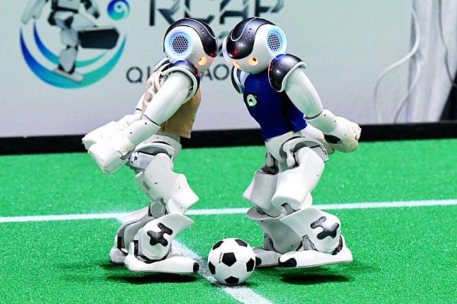 Robot soccer players compete during the RoboCup Asia-Pacific 2024 in Qingdao, east China's Shandong Province, Oct. 26, 2024. More than 200 teams from over 20 countries and regions participated in this competition. (Photo by Yu Fangping/Xinhua)