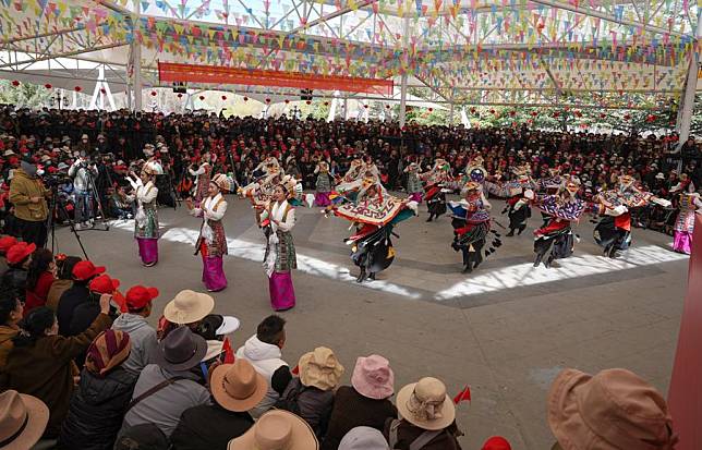 People watch a performance at a park to celebrate the Serfs' Emancipation Day in Lhasa, capital of southwest China's Xizang Autonomous Region, March 28, 2024. (Xinhua/Jigme Dorje)
