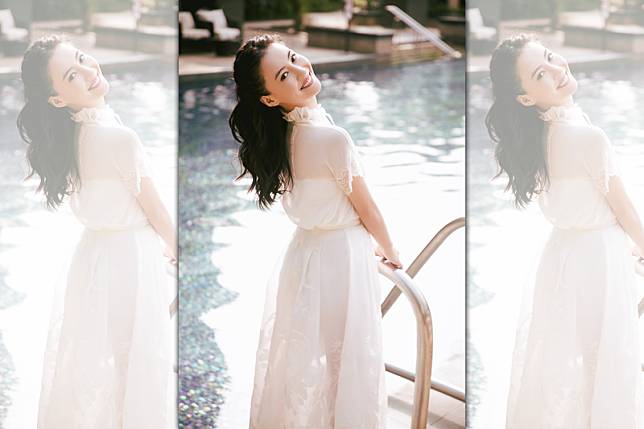 張栢芝身穿一襲白色落地透紗裙，長髮飄逸回眸一笑，猶如剛出道時的她。（翻攝自微博）