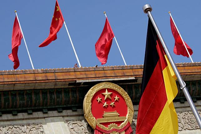 A German flag flutters outside the Great Hall of the People in Beijing before the welcome ceremony for German Chancellor Angela Merkel in May 2018. Photo: Reuters