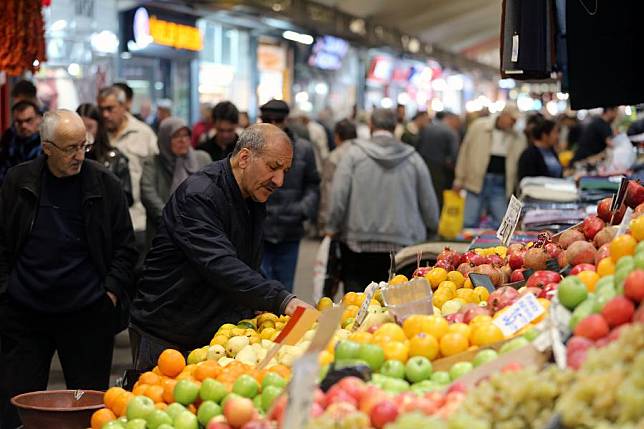 A man shops at a local market in Ankara, Türkiye, on Nov. 8, 2024. (Photo by Mustafa Kaya/Xinhua)