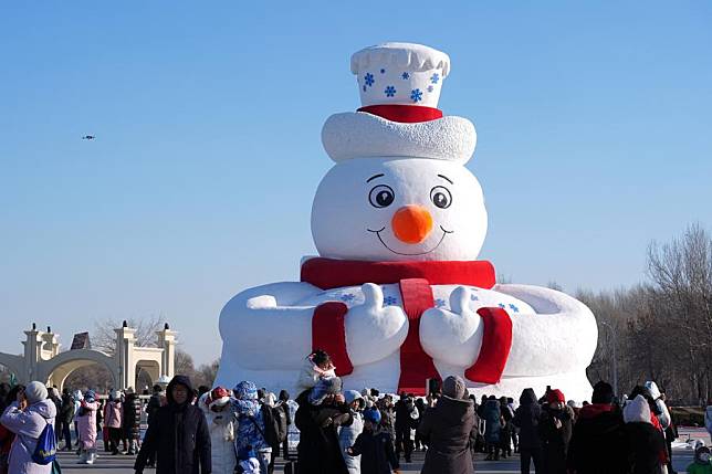 Tourists visit the 37th Sun Island International Snow Sculpture Expo in Harbin, northeast China's Heilongjiang Province, Dec. 23, 2024. The 37th Sun Island International Snow Sculpture Expo began its trial operation here Monday. (Xinhua/Wang Song)