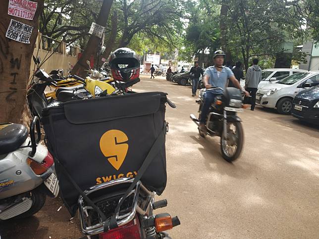 A Swiggy delivery person’s two-wheeler parked in Bengaluru. Photo by Avanish Tiwary