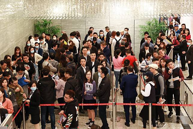 Potential buyers queue up for Sun Hung Kai Properties’ offer of 335 flats at its Wetland Seasons Park residential project, on January 11. Ricacorp expects new flat sales to boost property transactions this year. Photo: May Tse