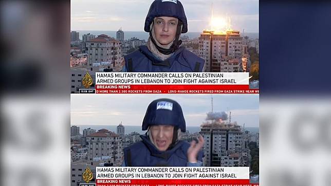 《半島電視台》女記者賽義德（Youmna El Sayed）報導戰況時，身後一棟巴勒斯坦高樓被飛彈擊中。（圖／翻攝自《每日郵報》）