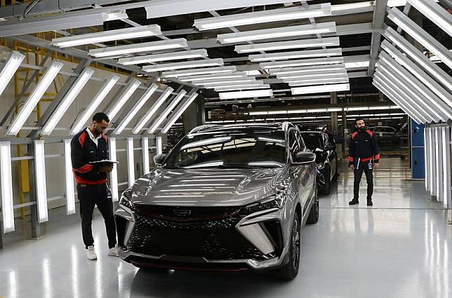 Workers operate at a production line of the plant of Chinese automotive manufacturer Geely Auto Group in the 6th of October City, Giza Province, Egypt, on Jan. 15, 2025. (Xinhua/Wang Dongzhen)