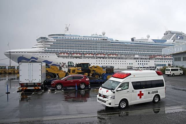 An ambulance believed to be carrying an infected passenger of the Diamond Princess cruise ship leaves the Daikoku Pier Cruise Terminal in Yokohama, south of Tokyo. Photo: EPA-EFE