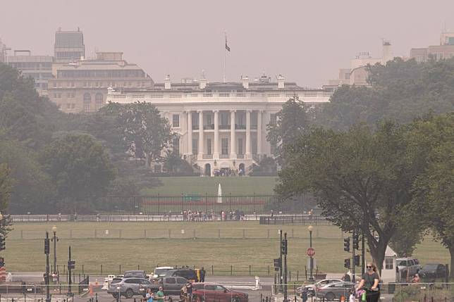 The White House is shrouded in haze in Washington, D.C., the United States, on June 29, 2023. (Photo by Aaron Schwartz/Xinhua)