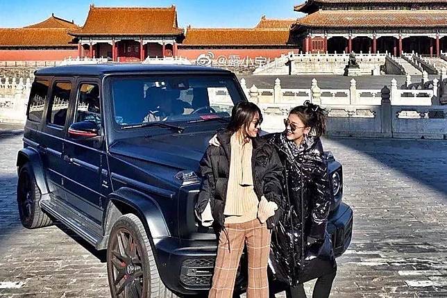 Pictures of the two women posing in front of the SUV prompted an outcry on social media. Photo: Weibo