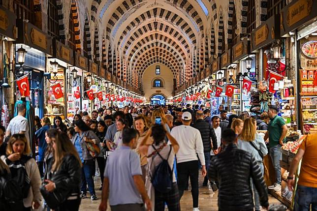 Tourists visit the Spice Bazaar in Istanbul, Türkiye, Oct. 31, 2024. Established in the 1660s, the Spice Bazaar remains one of Istanbul's most iconic covered shopping complexes and touristic attractions. (Xinhua/Liu Lei)