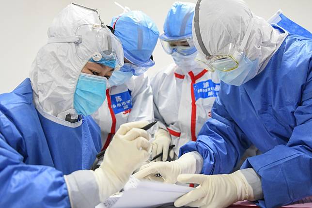 Medical workers check patient information in Wuhan, the outbreak’s epicentre. Photo: Xinhua