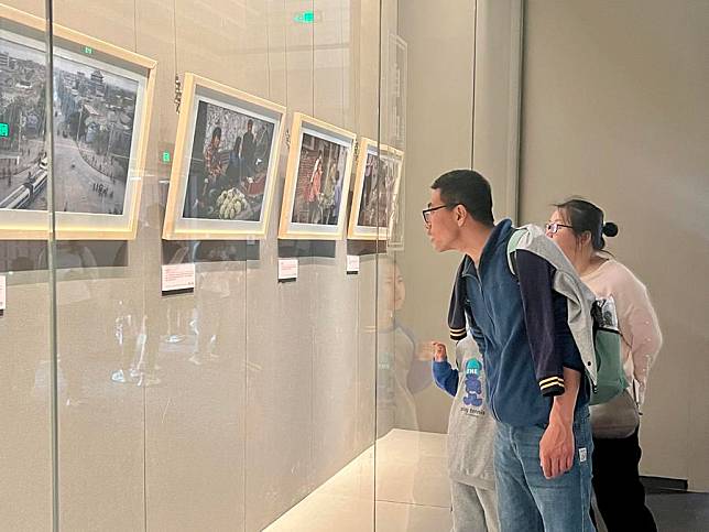 Visitors view photos exhibited at a photography exhibition named “Encounters·Silk Road–Xi'an in the Eyes of an Italian Journalist” at Xi'an Museum in Xi'an, northwest China's Shaanxi Province, May 1, 2024. (Xinhua/Cai Xinyi)