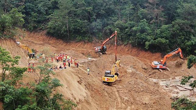 An aerial drone photo taken on May 2, 2024 shows rescuers and excavators working at the site of an expressway collapse on the Meizhou-Dabu Expressway in Meizhou, south China's Guangdong Province. (Xinhua/Wang Ruiping)