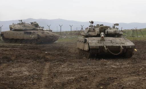 AFP/JALAA MAREY รถถังของกองทัพอิราเอลรวมพลในที่ราบสูงโกลันเมื่อวันที่ 20 มกราคม 2562