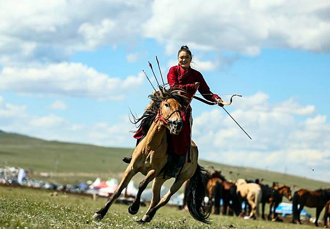 A horsewoman participates in a horsemanship performance during a nomadic culture festival in the Nalaikh District of Ulan Bator, Mongolia, Aug. 19, 2023. (Xinhua/Lan Hongguang)