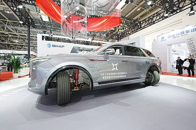 A visitor tries a car at the booth of China's Ketian New Material at the second China International Supply Chain Expo (CISCE) in Beijing, capital of China, Nov. 28, 2024. (Xinhua/Xu Hongyan)