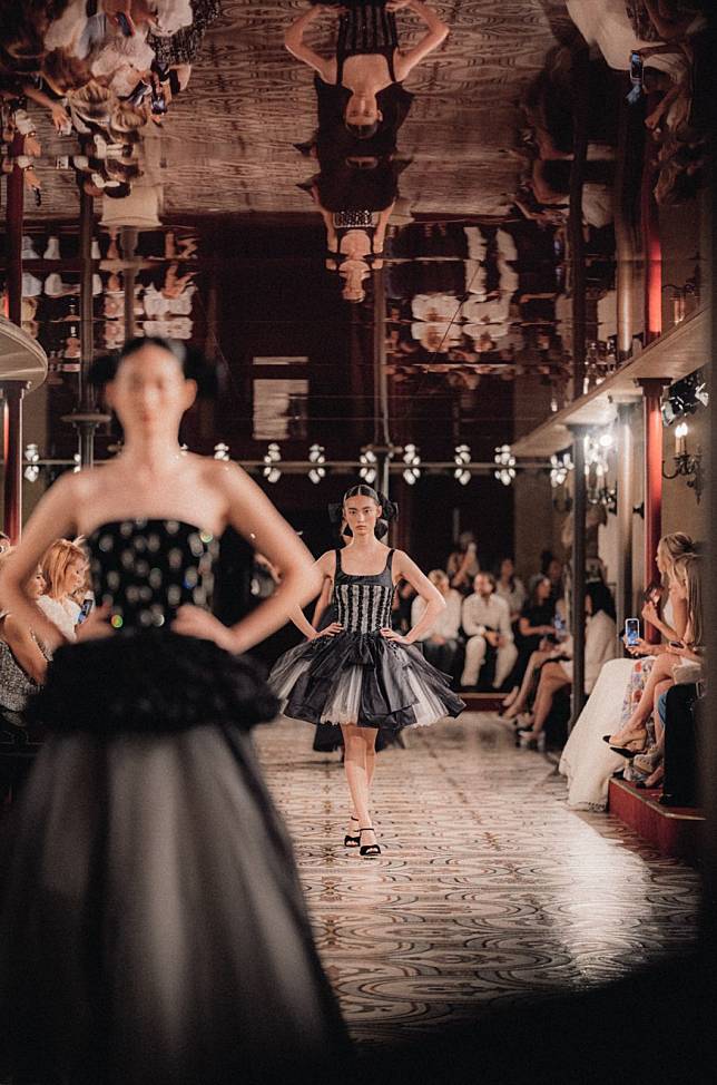 Under the artistic direction of French director Christophe Honoré, the grand corridors surrounding the auditorium were transformed into opulent red velvet opera boxes for the occasion