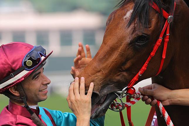 Joao Moreira gives Beat The Clock a pat after their win in the Chairman’s Sprint Prize. Photos: Kenneth Chan