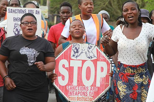 People protest against U.S.-imposed sanctions on Zimbabwe in front of the United States Embassy in Harare, Zimbabwe, on Oct. 25, 2024. (Xinhua/Tafara Mugwara)