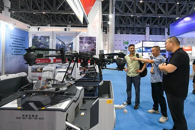 Visitors look at unmanned aerial vehicle (UAV) products at the 2024 Chengdu International Low-altitude Equipment and Services Expo in Chengdu, southwest China's Sichuan Province, Sept. 20, 2024. (Xinhua/Tang Wenhao)