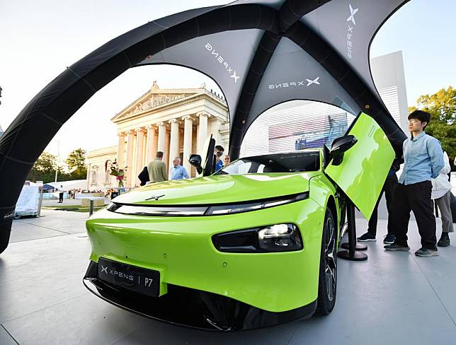 People visit the booth of Chinese carmaker Xpeng during the 2023 International Motor Show, officially known as the IAA MOBILITY 2023, in Munich, Germany, Sept. 5, 2023. (Xinhua/Ren Pengfei)