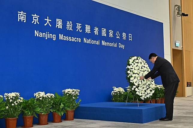 Acting Chief Executive of the Hong Kong Special Administrative Region (HKSAR) Chan Kwok-ki lays a wreath to mourn the victims of the Nanjing Massacre during a commemoration ceremony in south China's Hong Kong, Dec. 13, 2024. (Information Services Department of the Government of the HKSAR/Handout via Xinhua)