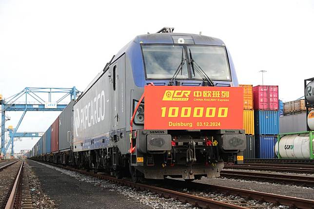 This photo taken on Dec. 3, 2024 shows the 100,000th China-Europe freight train at Duisburg Intermodal Terminal (DIT) in Duisburg, Germany. (Xinhua/Du Zheyu)