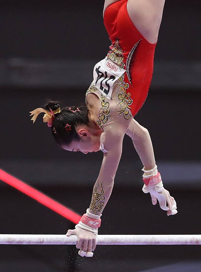 Teenager Wei rebounds to win uneven bars as China adds two more golds at  gymnastics worlds, XINHUA