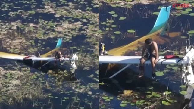 pilot standing on wing of small plane after crashing in Everglades-016