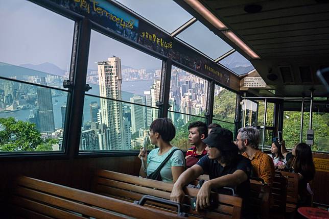 Passengers on the Peak Tram look at the Hong Kong skyline. The city’s tourism industry is experiencing its sharpest downturn since the Sars epidemic in 2003. Photo: Bloomberg