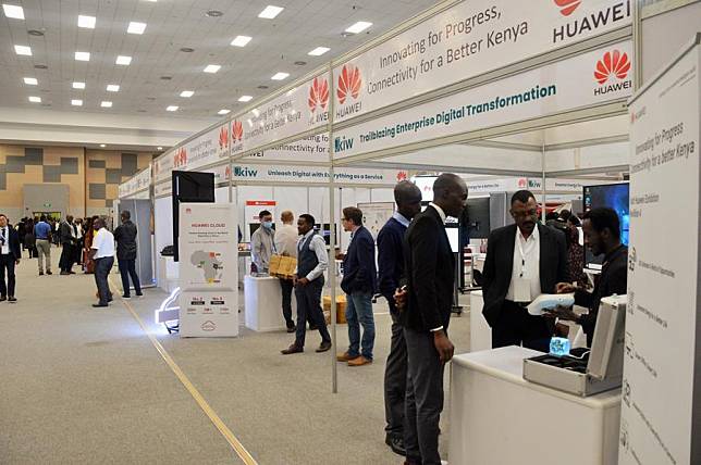 People visit the booth of Huawei during the Kenya Innovation Week 2022 in Nairobi, Kenya, Dec. 6, 2022. (Photo by Charles Onyango/Xinhua)