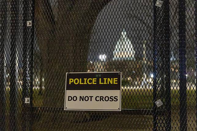 This photo taken on Jan. 5, 2025 shows the U.S. Capitol building seen through a security fence in Washington, D.C., the United States. (Xinhua/Hu Yousong)