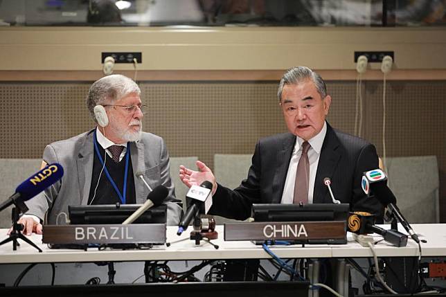 Chinese Foreign Minister Wang Yi and Celso Amorim, special advisor to the President of Brazil, jointly meet the press after a ministerial meeting of the newly launched &ldquo;Friends of Peace&rdquo; platform on the Ukraine crisis at the UN headquarters in New York, Sept. 27, 2024. (Xinhua/Xie E)