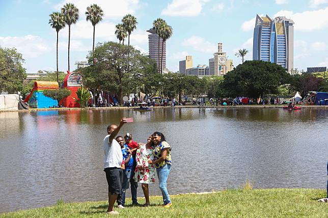 People take a selfie during New Year celebrations at Uhuru Park in the Kenyan capital of Nairobi on Jan. 1, 2025. (Photo by Joy Nabukewa/Xinhua)