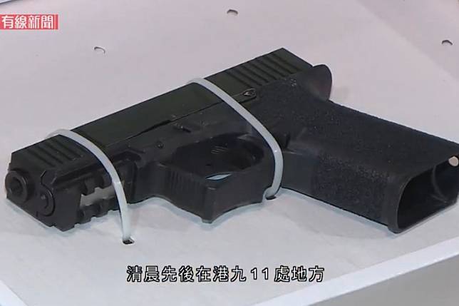 Police say they seized this 9mm pistol and other weapons during raids on Sunday morning. Photo: Cable TV News