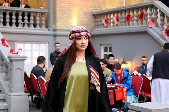 A model displays traditional Iraqi attire during a Spring Festival celebration held by the Iraq-China Friendship Association in Baghdad, Iraq, on Jan. 24, 2025.